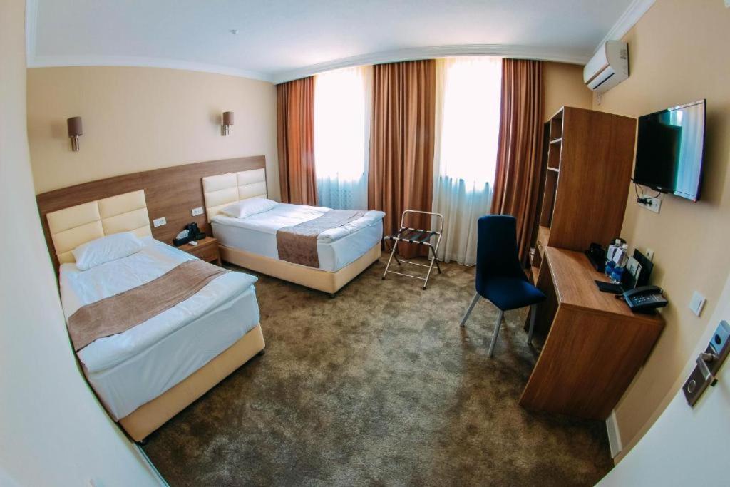 Osh Grand Hotel Chavo Esterno foto
